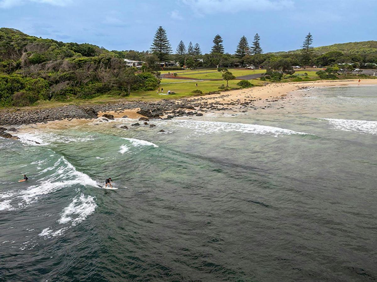 Aerial view of surfers, Point Plomer campground in the distance. Credit: John Spencer &copy; DCCEEW