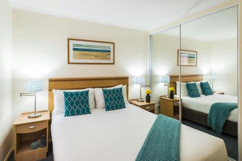 Oaks-Waterfront-Resort-1-Bedroom-Ocean-View-bedroom