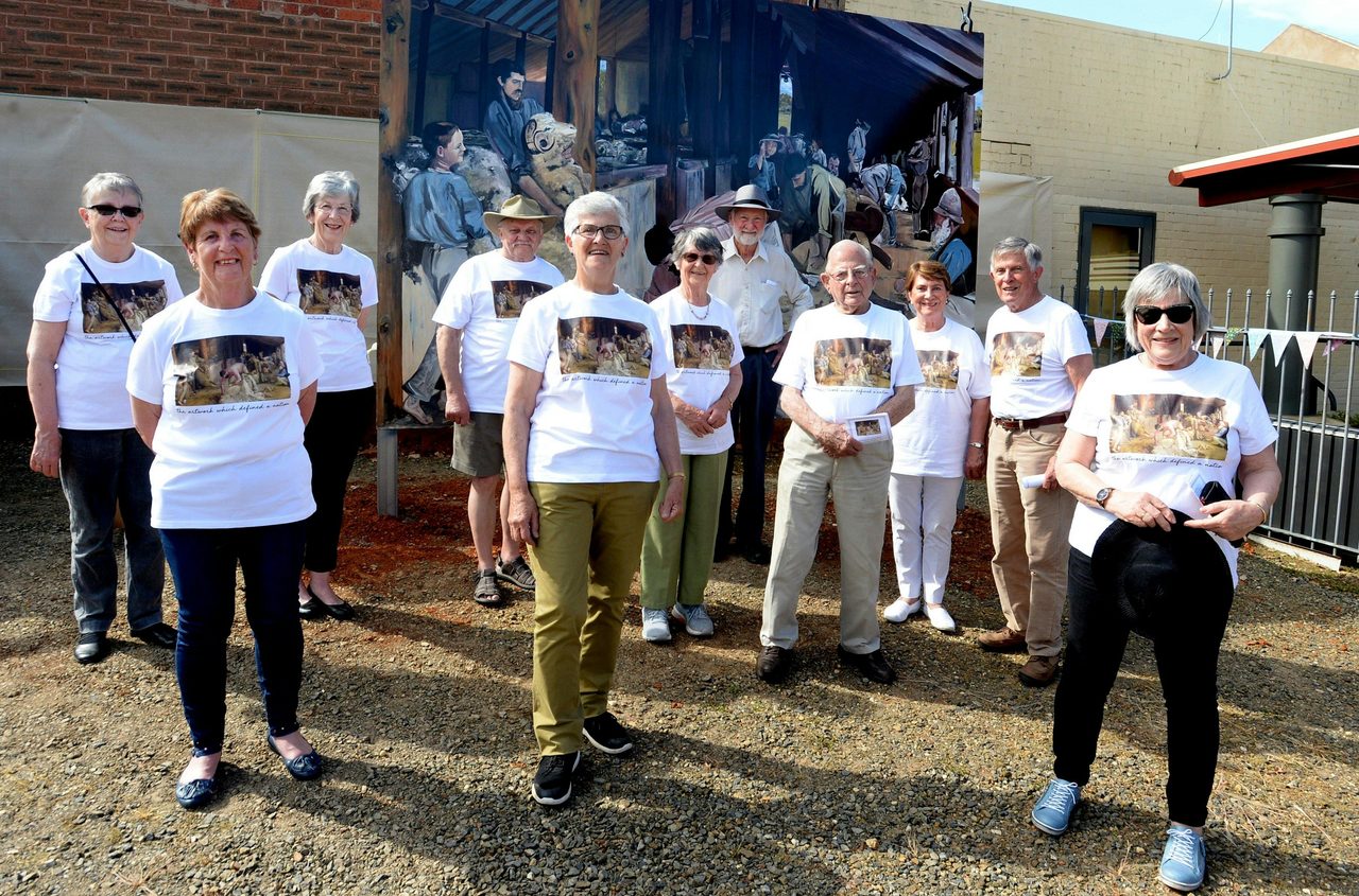 CDHS Volunteers modelling their special edition T-Shirts: 'the painting which defined a nation"