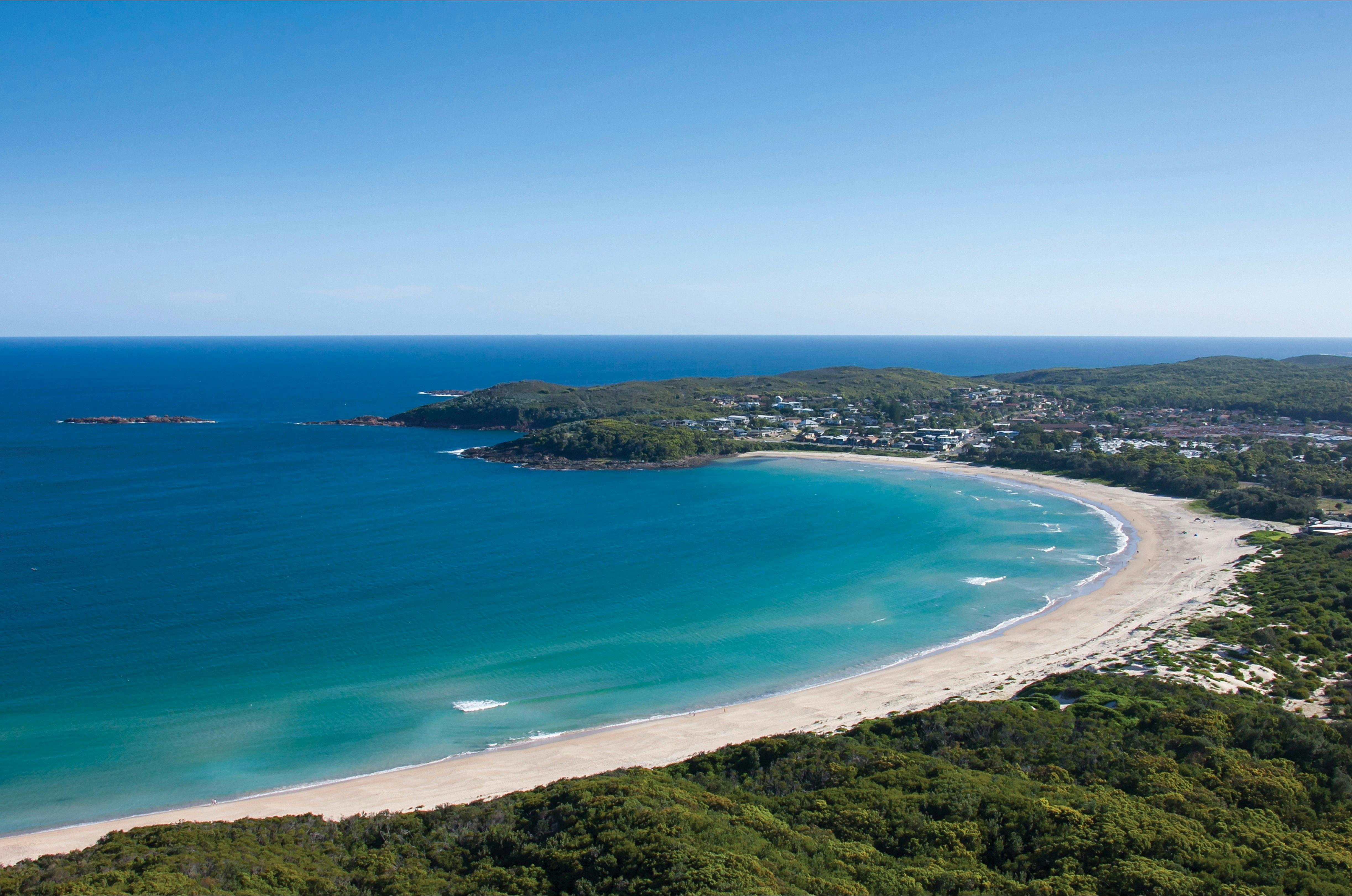 Coastal aerial of Fingal Beach in Fingal Bay, Port Stephens