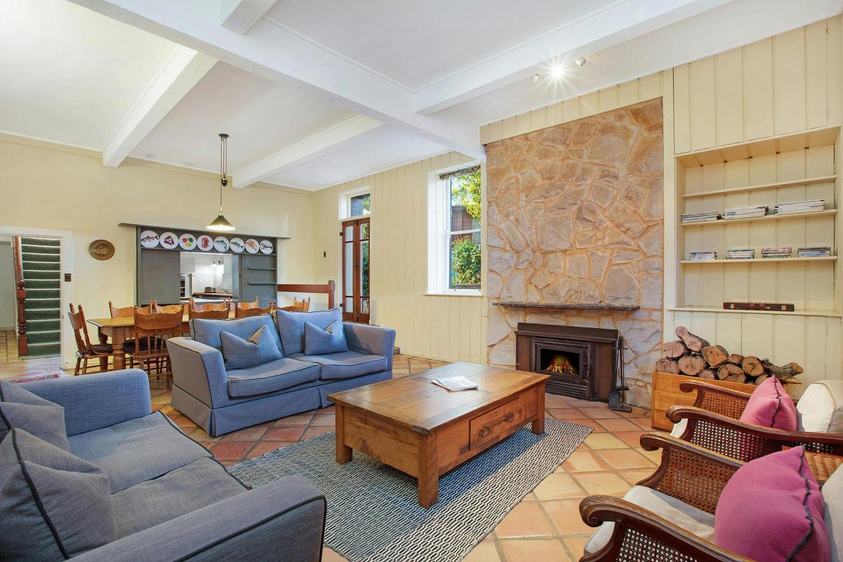 The lower floor living room with dining area which comfortably fits ten guests.