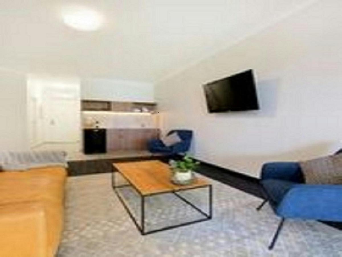 Lounge area- Kitchenette in background