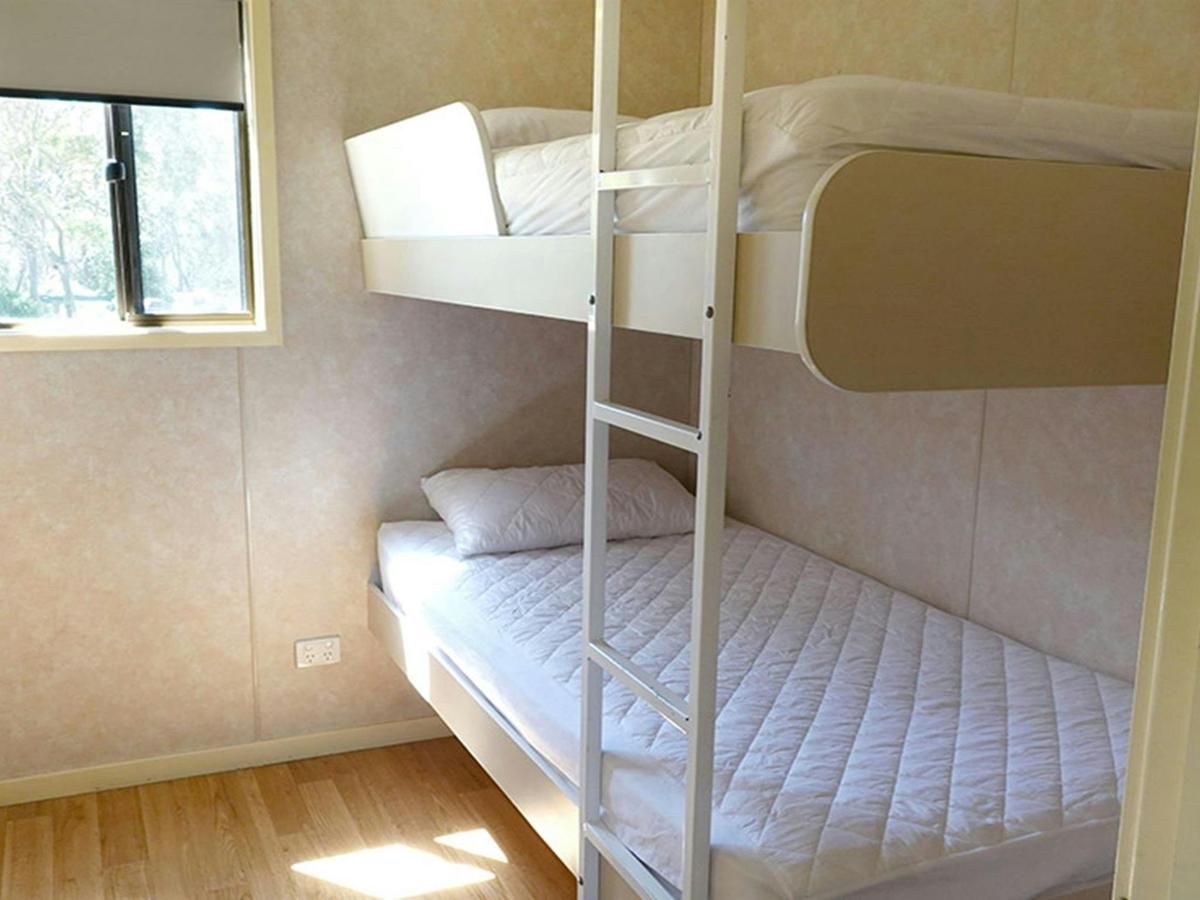 Room with bunk bed, Pretty Beach cabins. Credit: Billy Clare Reitzenstein &copy; DCCEEW