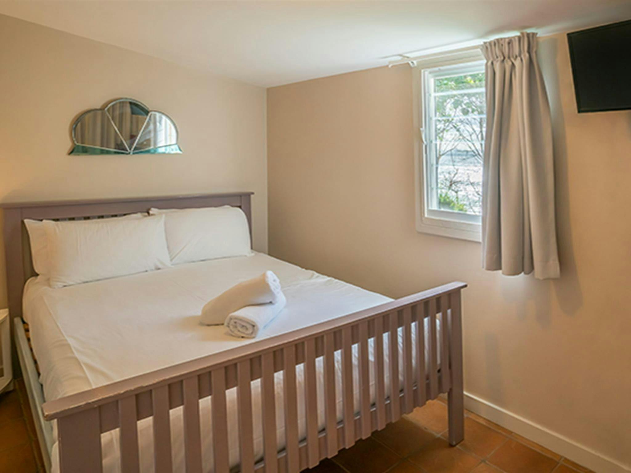 Main bedroom with television in Geoffs shed, Byron Bay. Photo: DPIE/John Spencer
