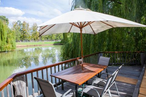 Villas feature lakeside decking for dining at sunrise and sunset over the lake.
