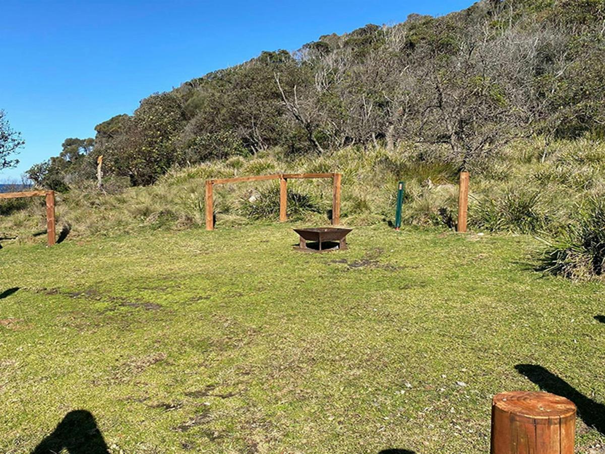Campsite 13 with fireplace at Picnic Point campground. Credit: &copy; DCCEEW