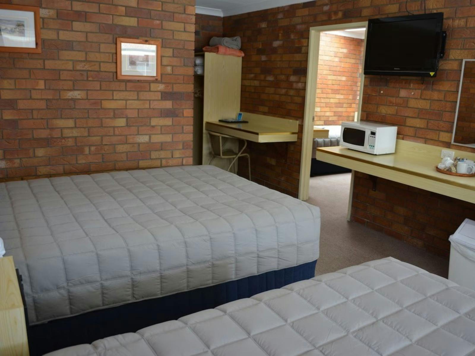 Bedroom at Peter Allen Motor Inn