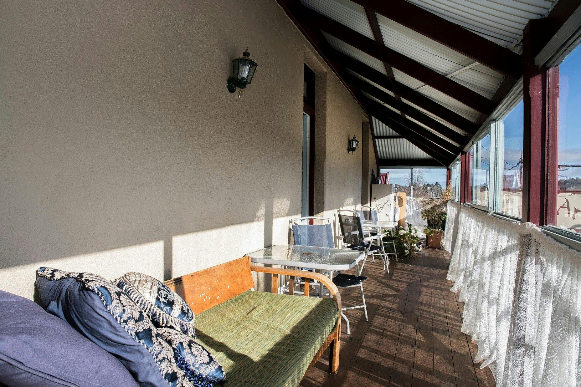 The glassed-in veranda is welcoming, and available for guests' use