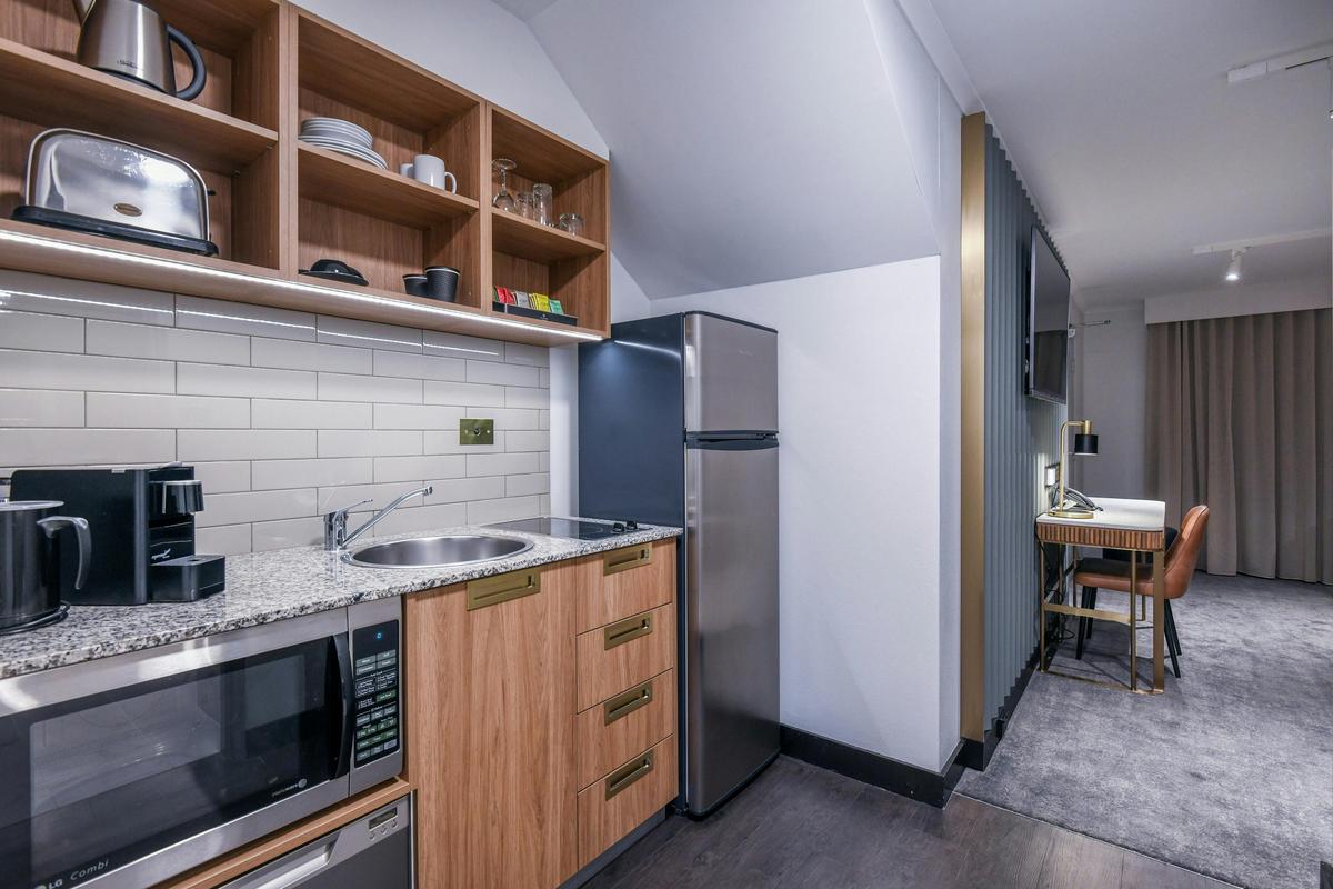 Full kitchen with coffee pod machine