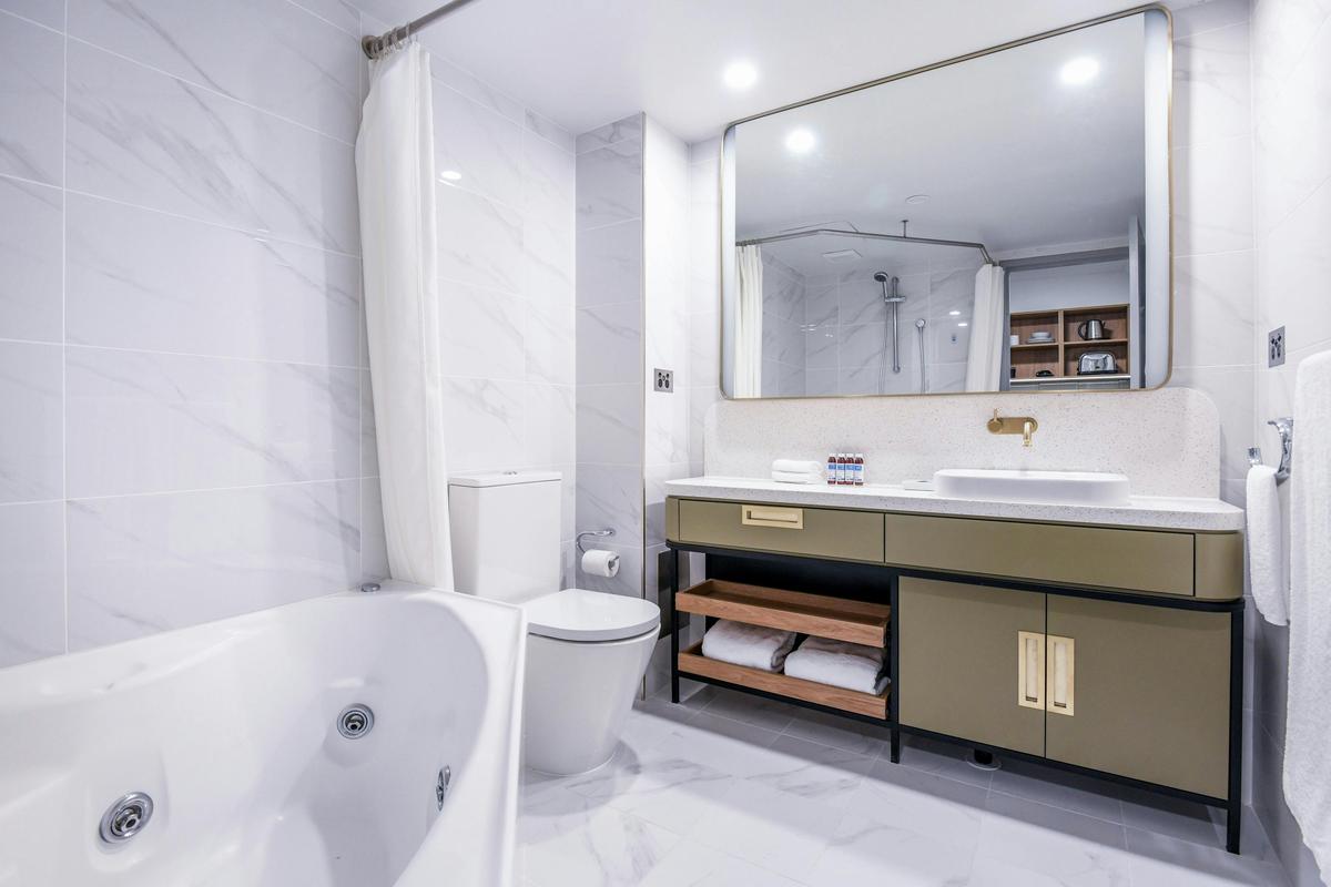 Marble bathroom with corner spa