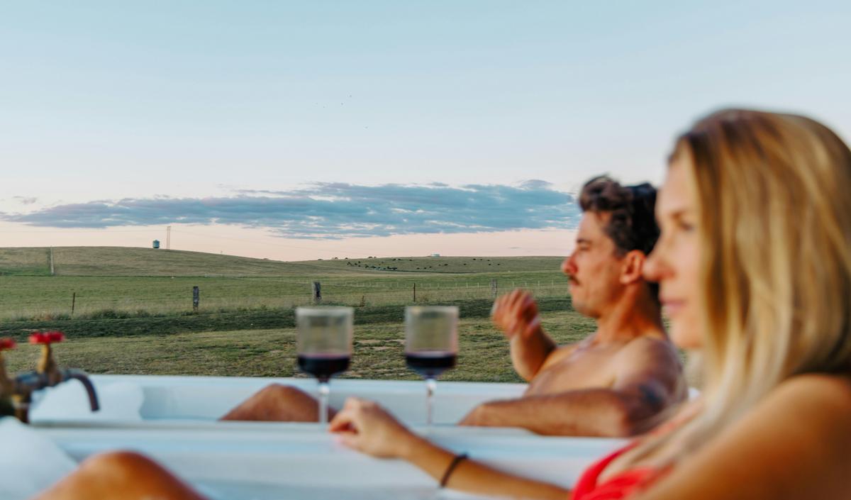 Outdoor baths allow you to soak with paddock views.