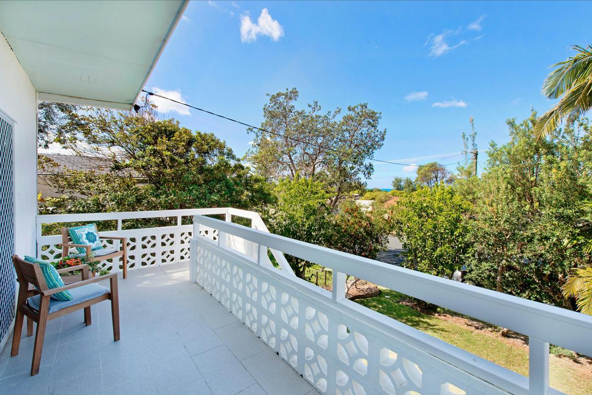 Front balcony with ocean glimpses