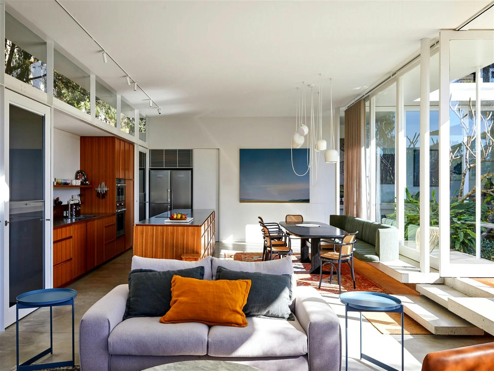 Open-plan living area, filled with natural light and offering garden views