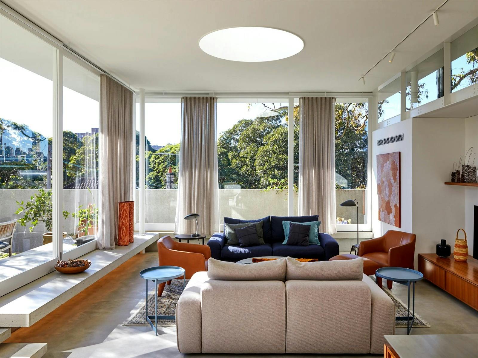 Open-plan living area, filled with natural light and offering garden views