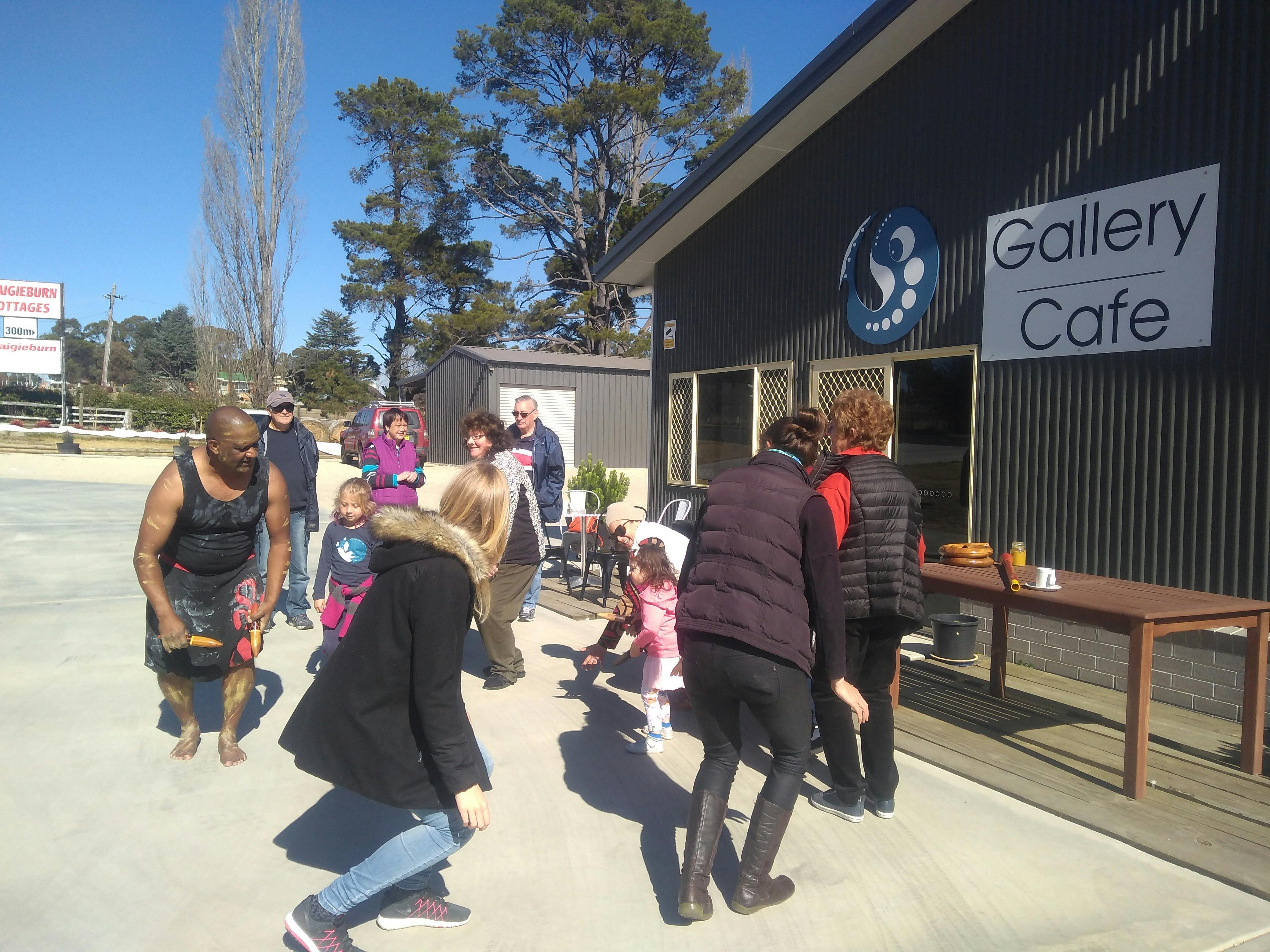 Group of tourists learning how to shake a leg with Bob Blair