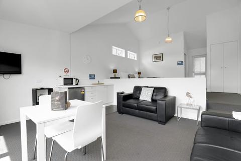 Living/dining space with kitchenette