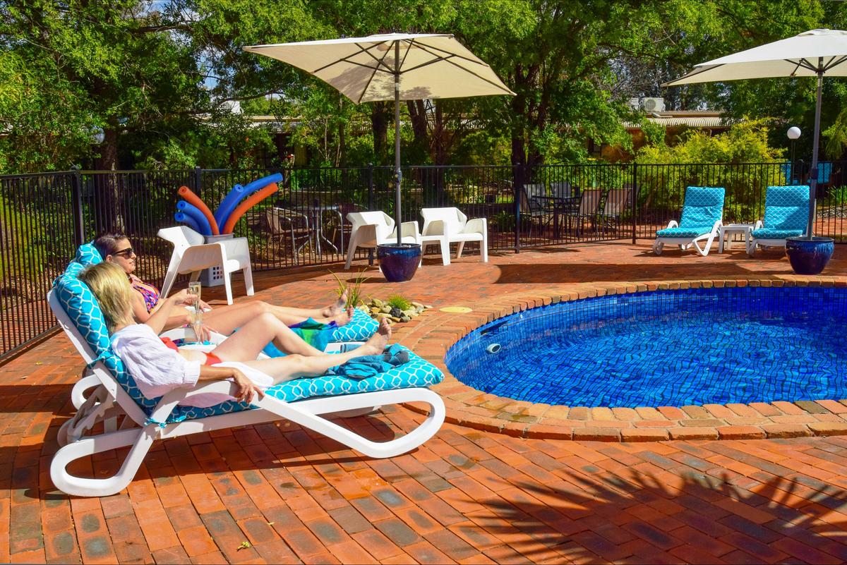 River Country Inn - Relaxing by the pool