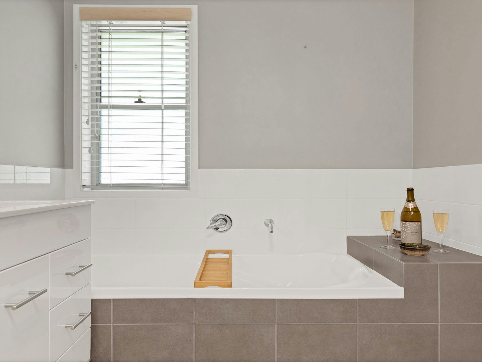 Bathroom with shower, vanity, and bathtub