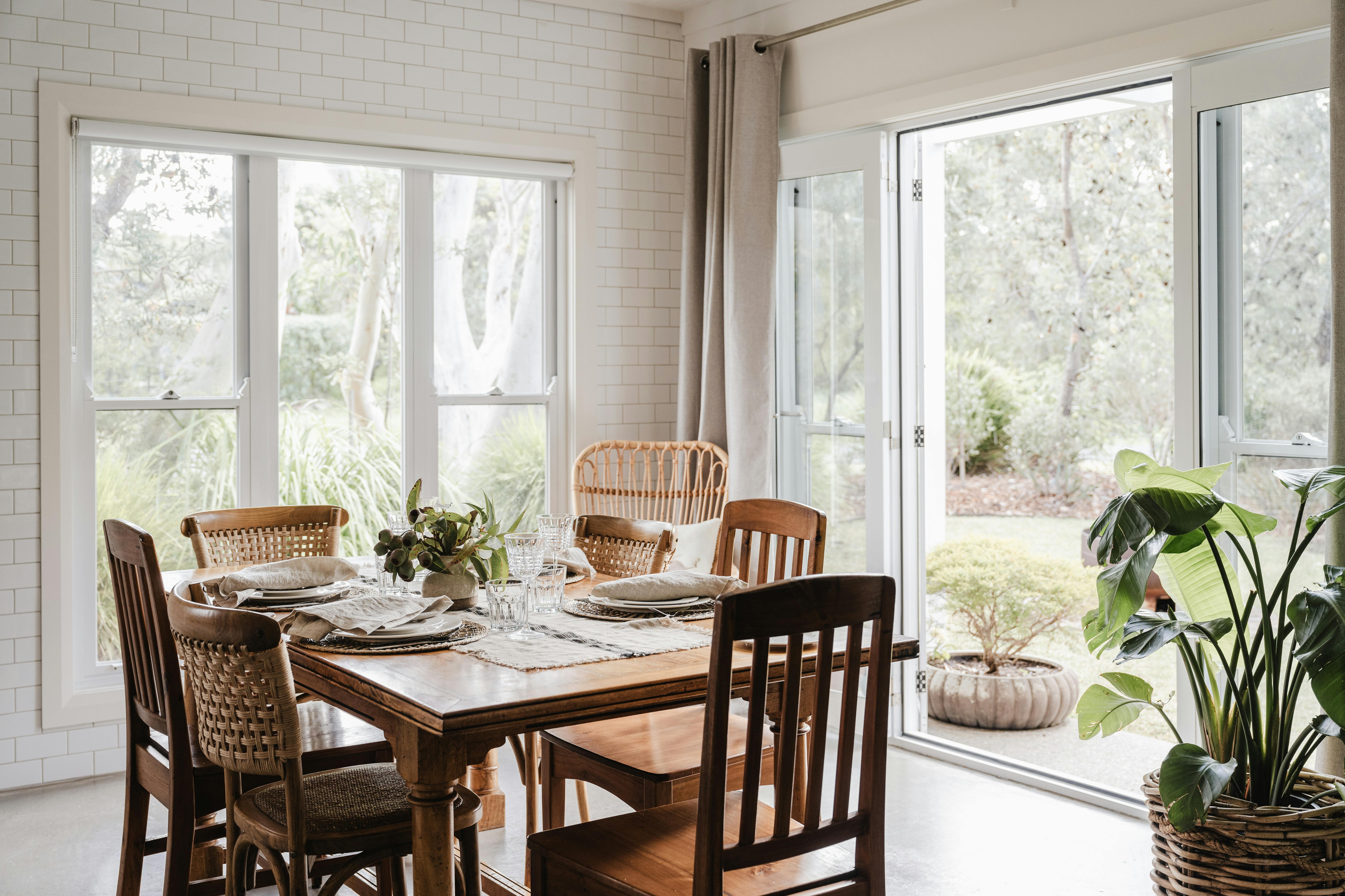 Indoor dining area with french doors leading out to the north facing garden area