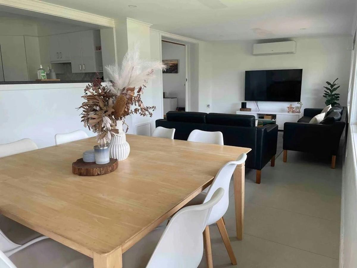large 8 seater dining table with living room and large flat screen tv
