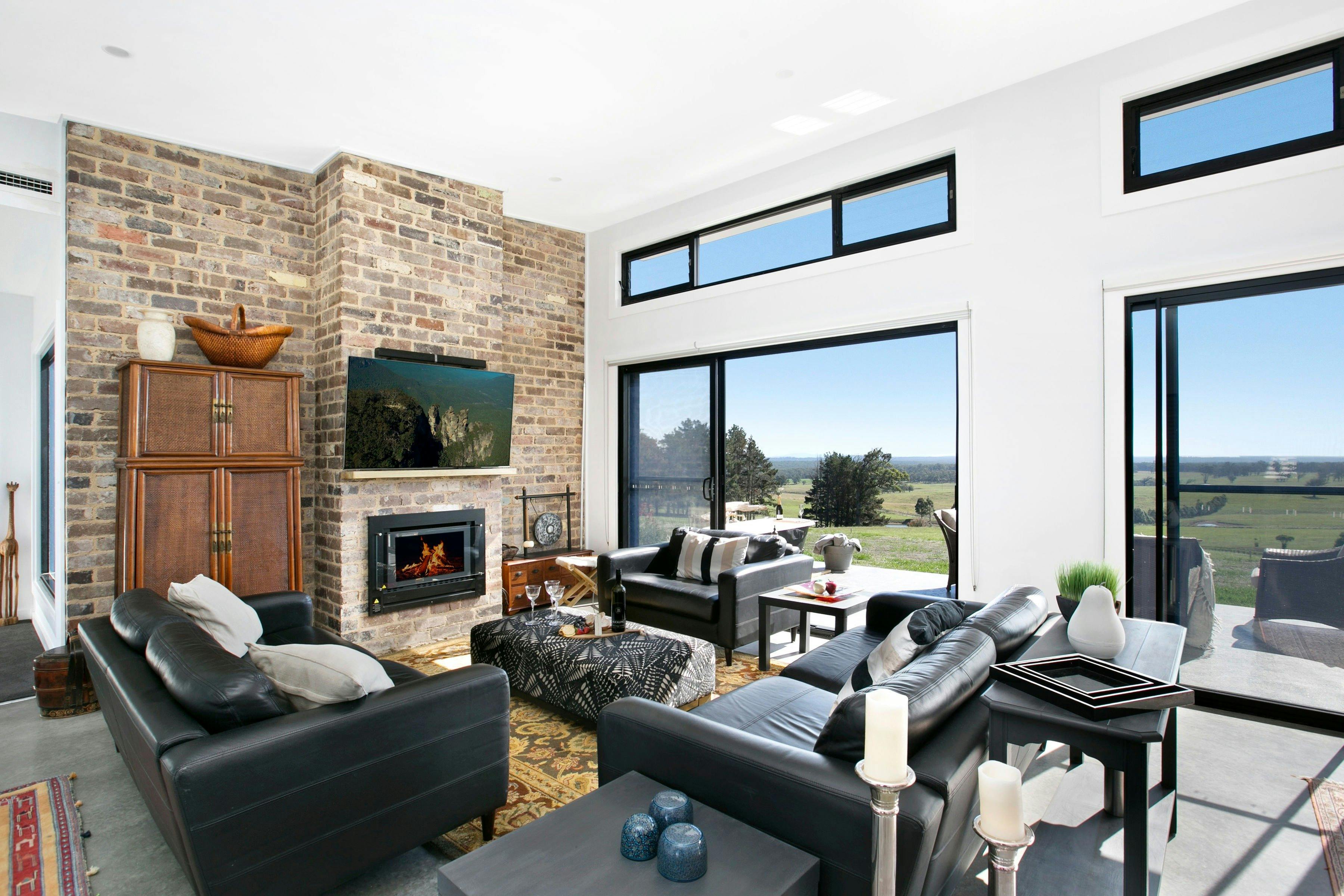 Cosy living area with fireplace, TV & sound system