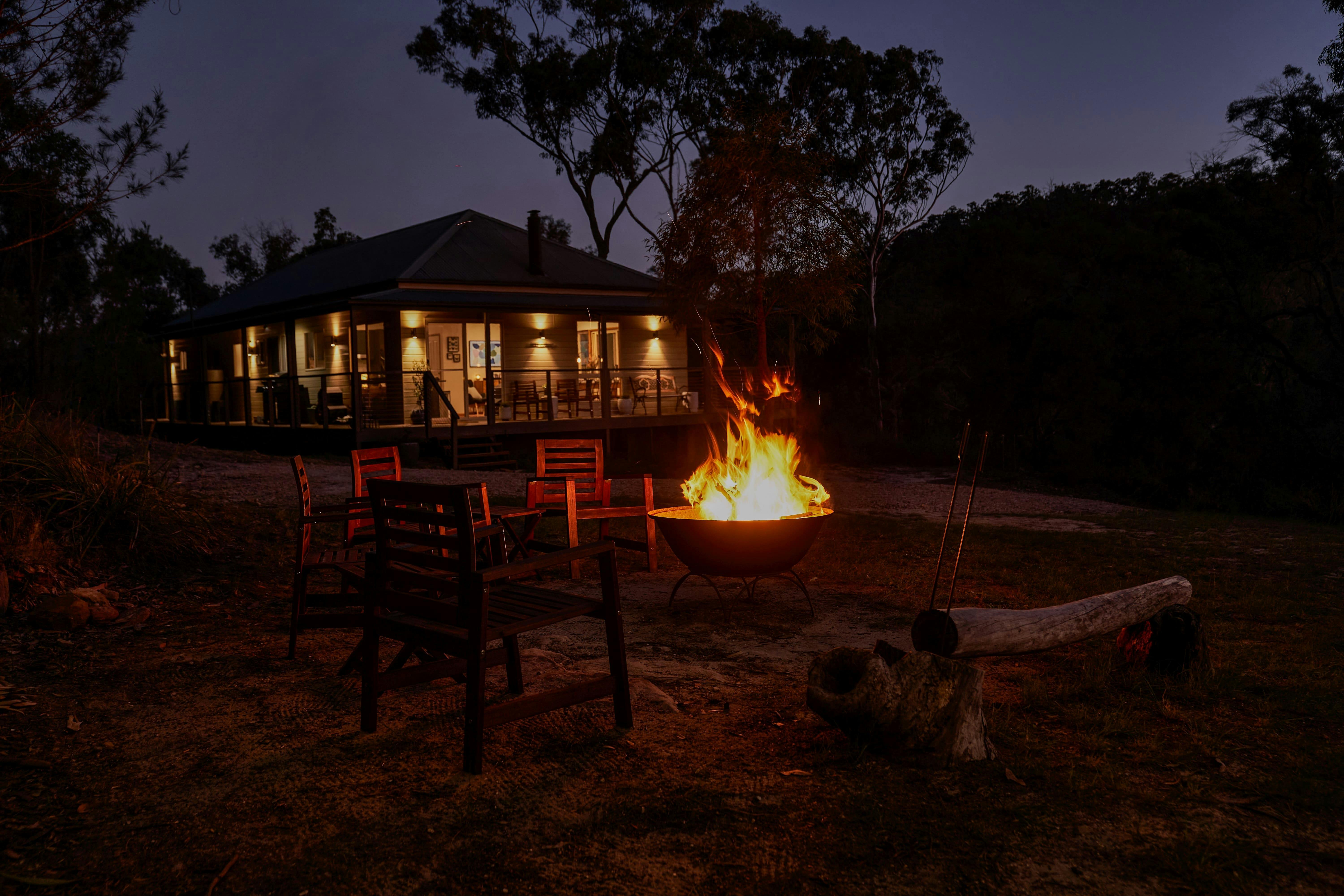 Gather around the fire pit under the festoon lights and stars