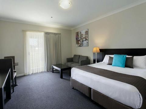 Photo of Bed and TV  in room