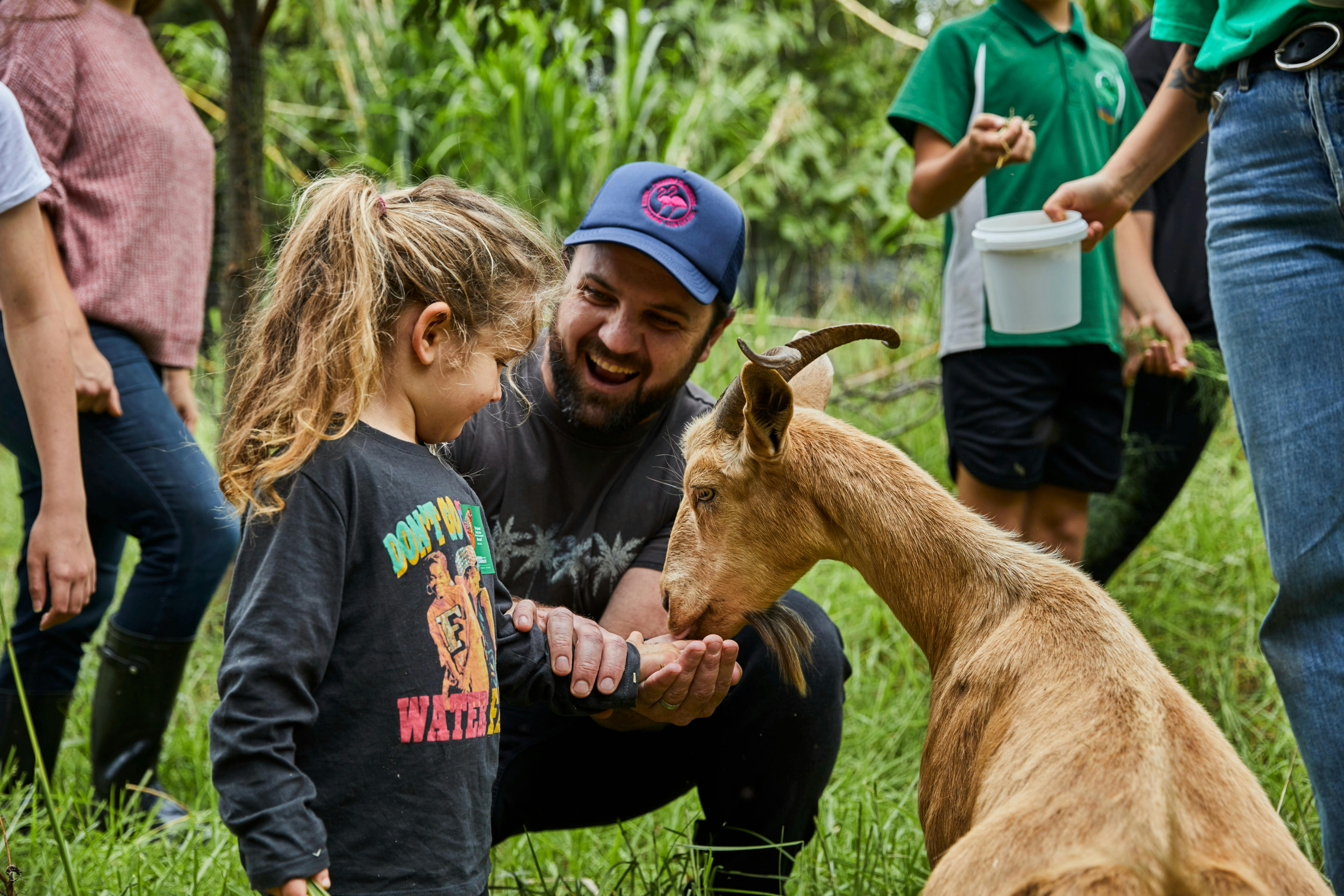 Feeding goats at the Green Connect Farm