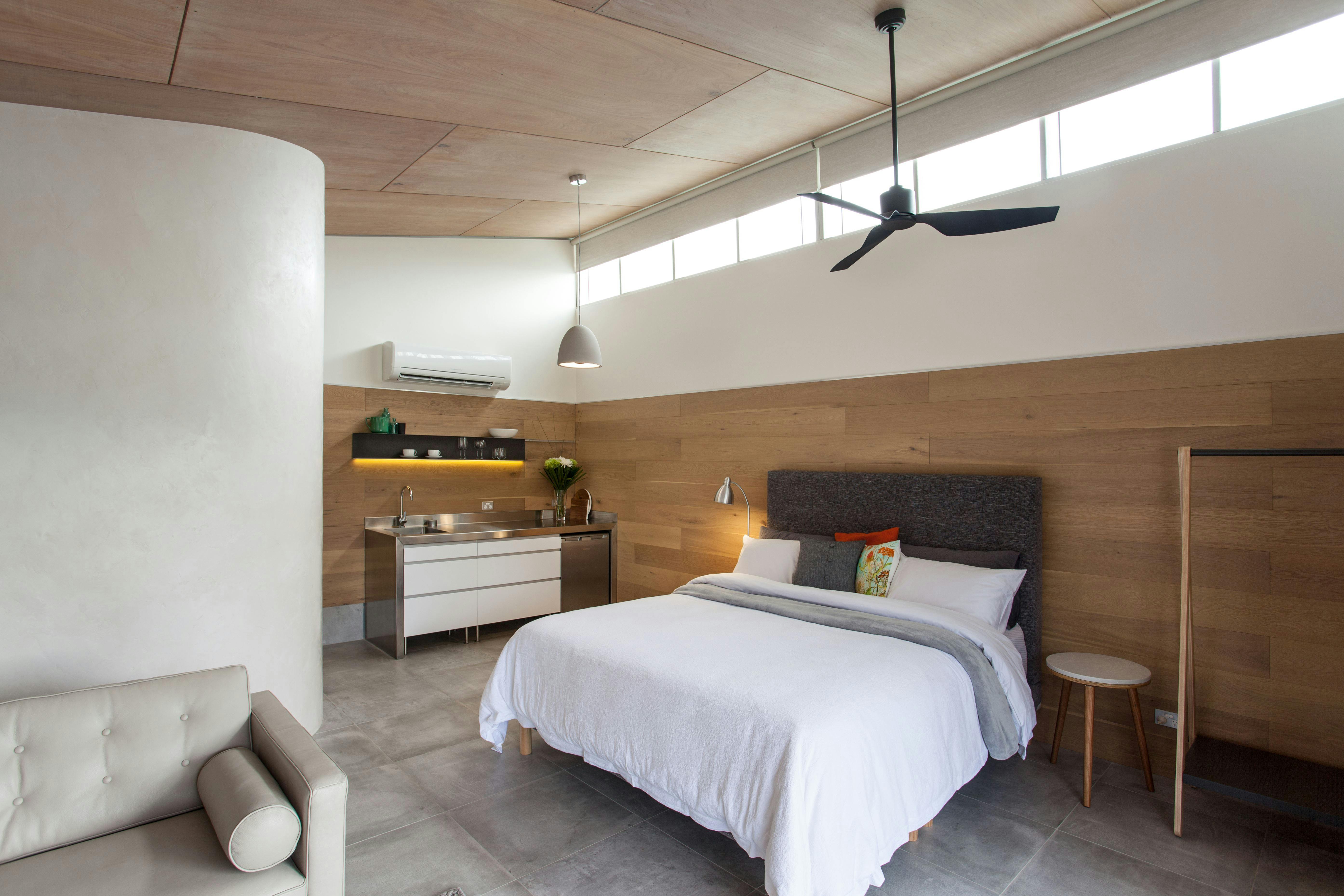 Bright interior with timber walls and raking ceiling