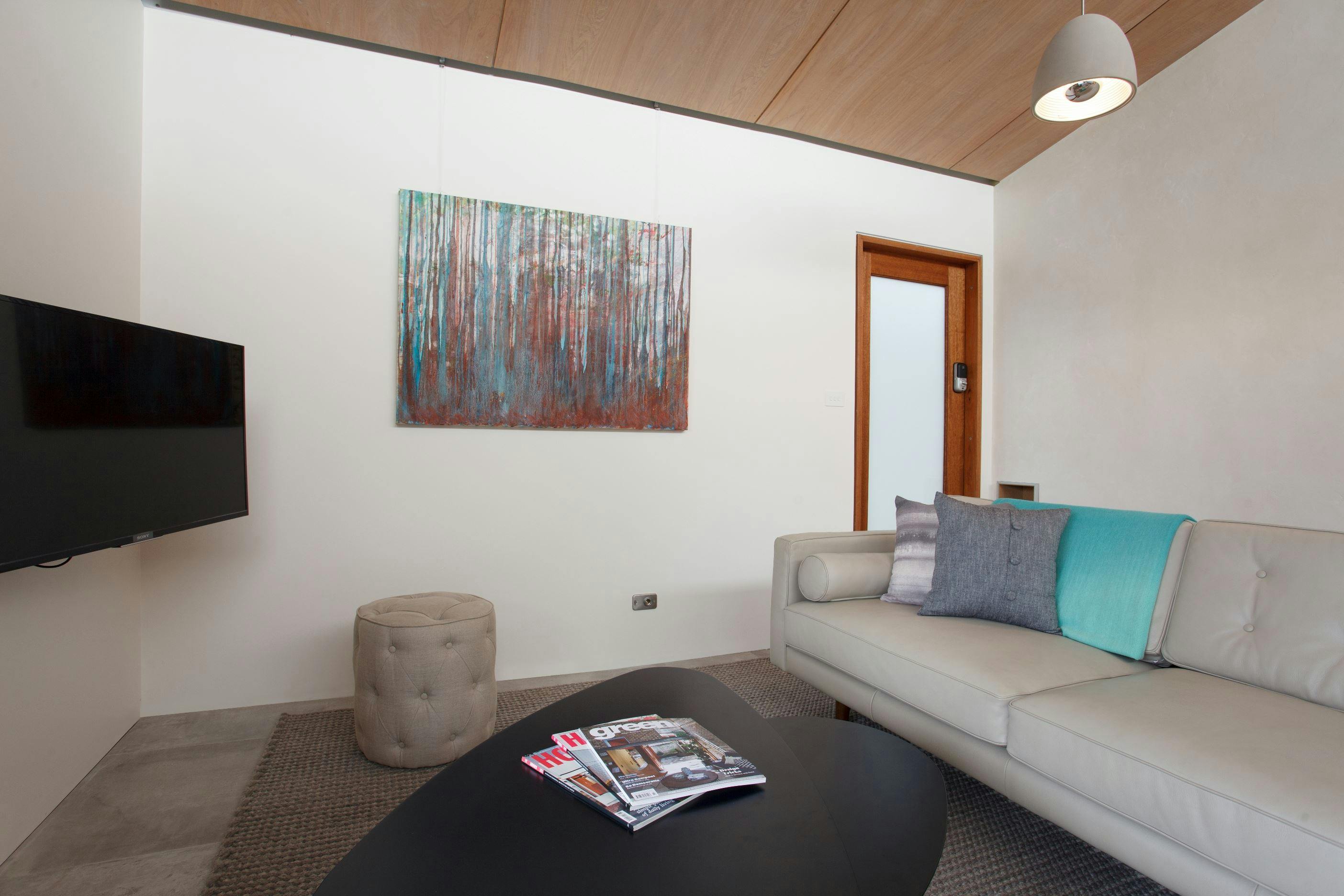 Leather couch and 40 inch television ensures a comfortable visit