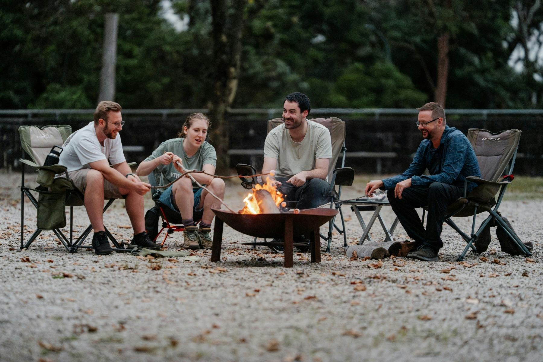 Connecting while enjoying a camp fire at StayKCC