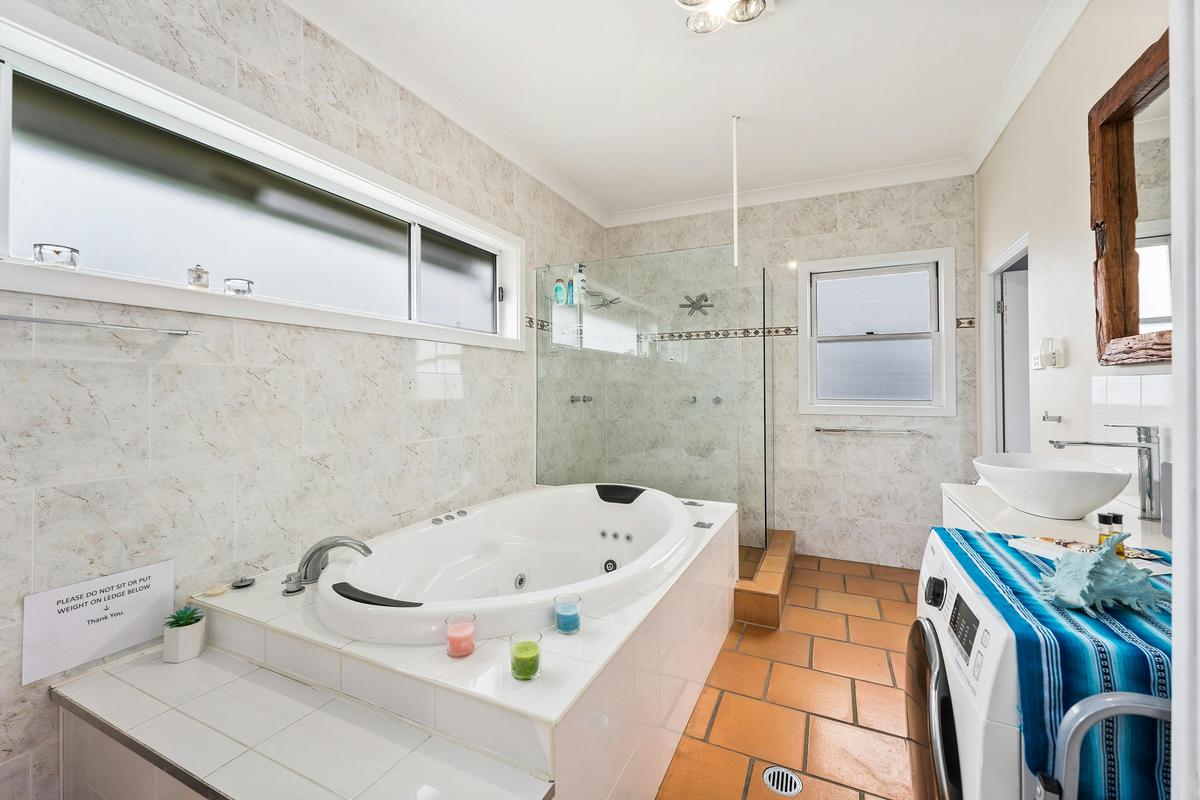Seaview suite bathroom with hydrotherapy spa and shower with double shower head