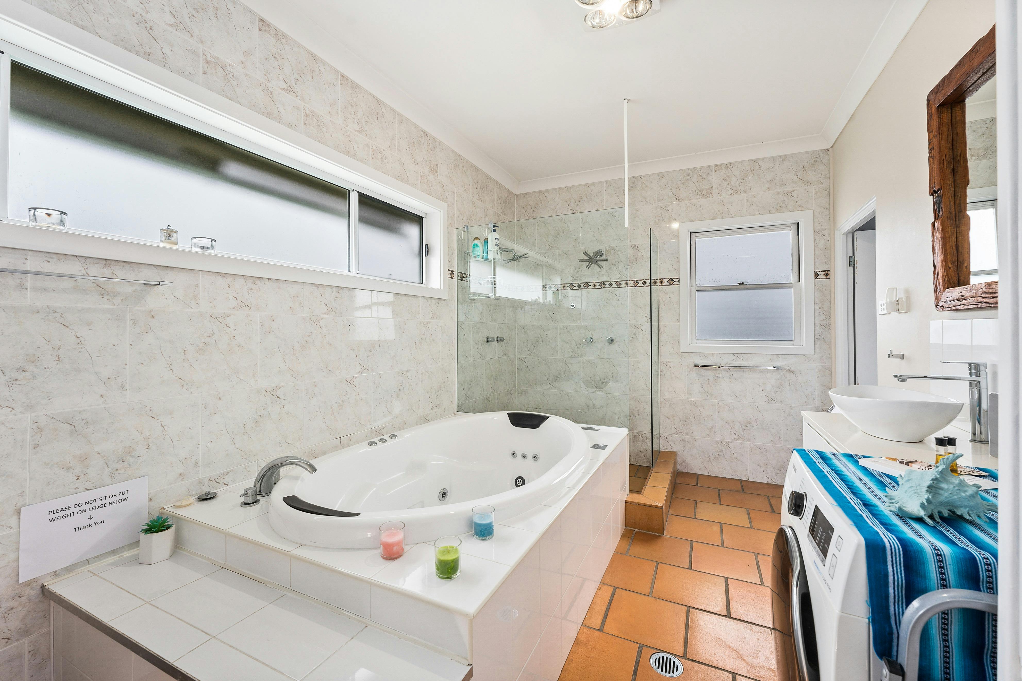 Seaview suite bathroom with hydrotherapy spa and shower with double shower head