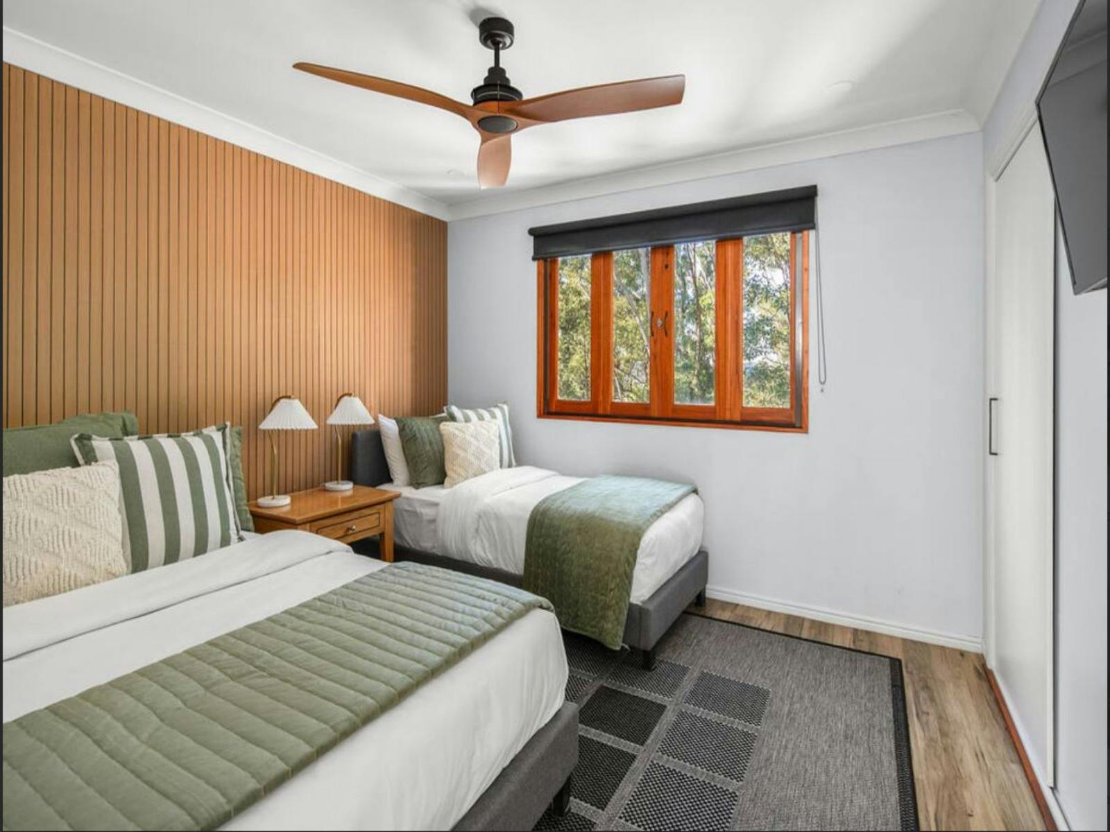 Breathe easy in this generously sized bedroom, offering a feeling of openness and calm.