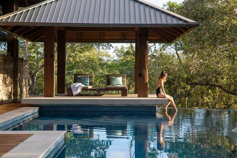 the infinity pool and its cabana