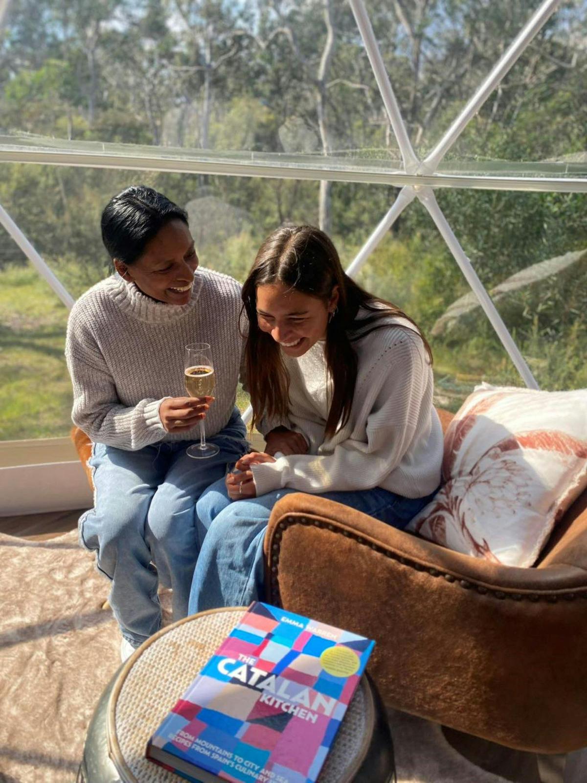 Laughing together in the comfy chairs in our domes