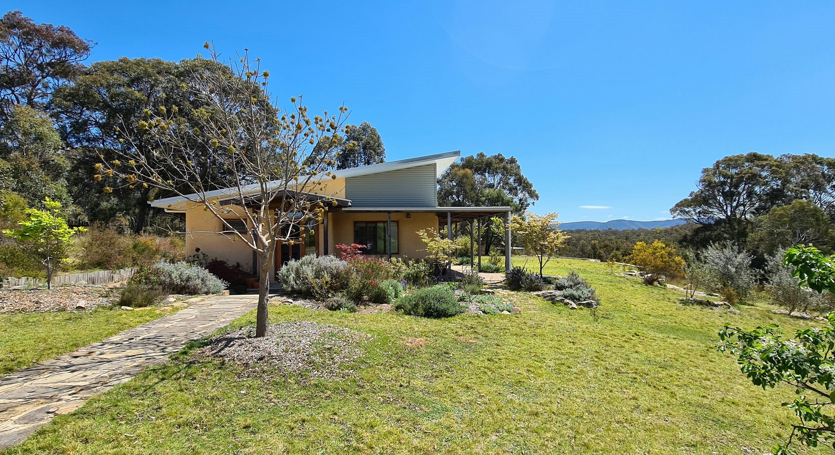 Entry to the Strawhouse through  ornamental gardens