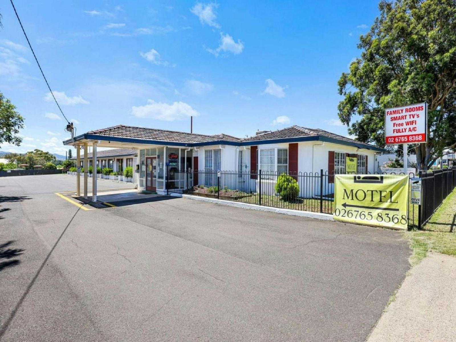Photo of entry from the road with reception and welcome sign