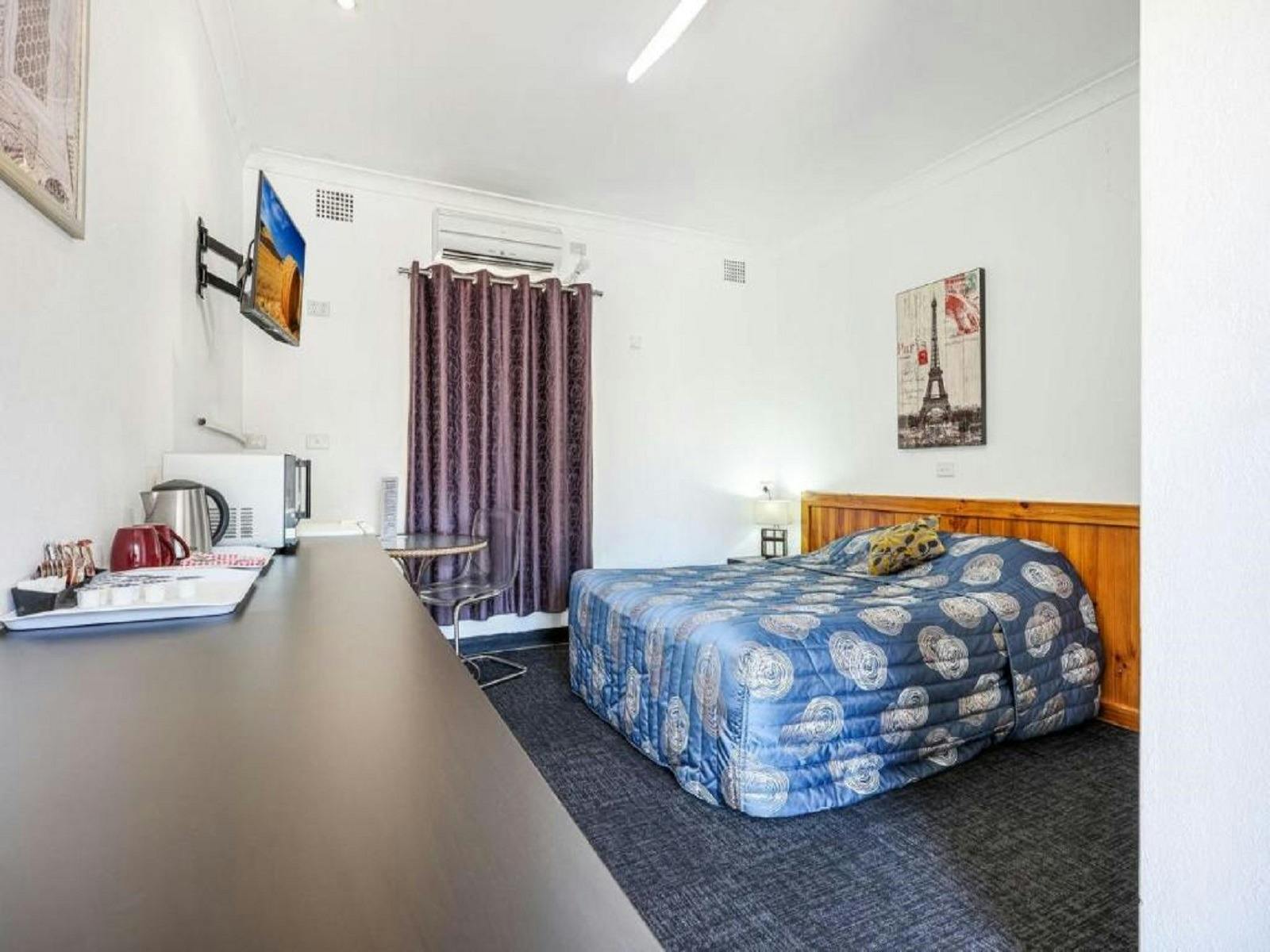 Photo of double bed inside one of the rooms