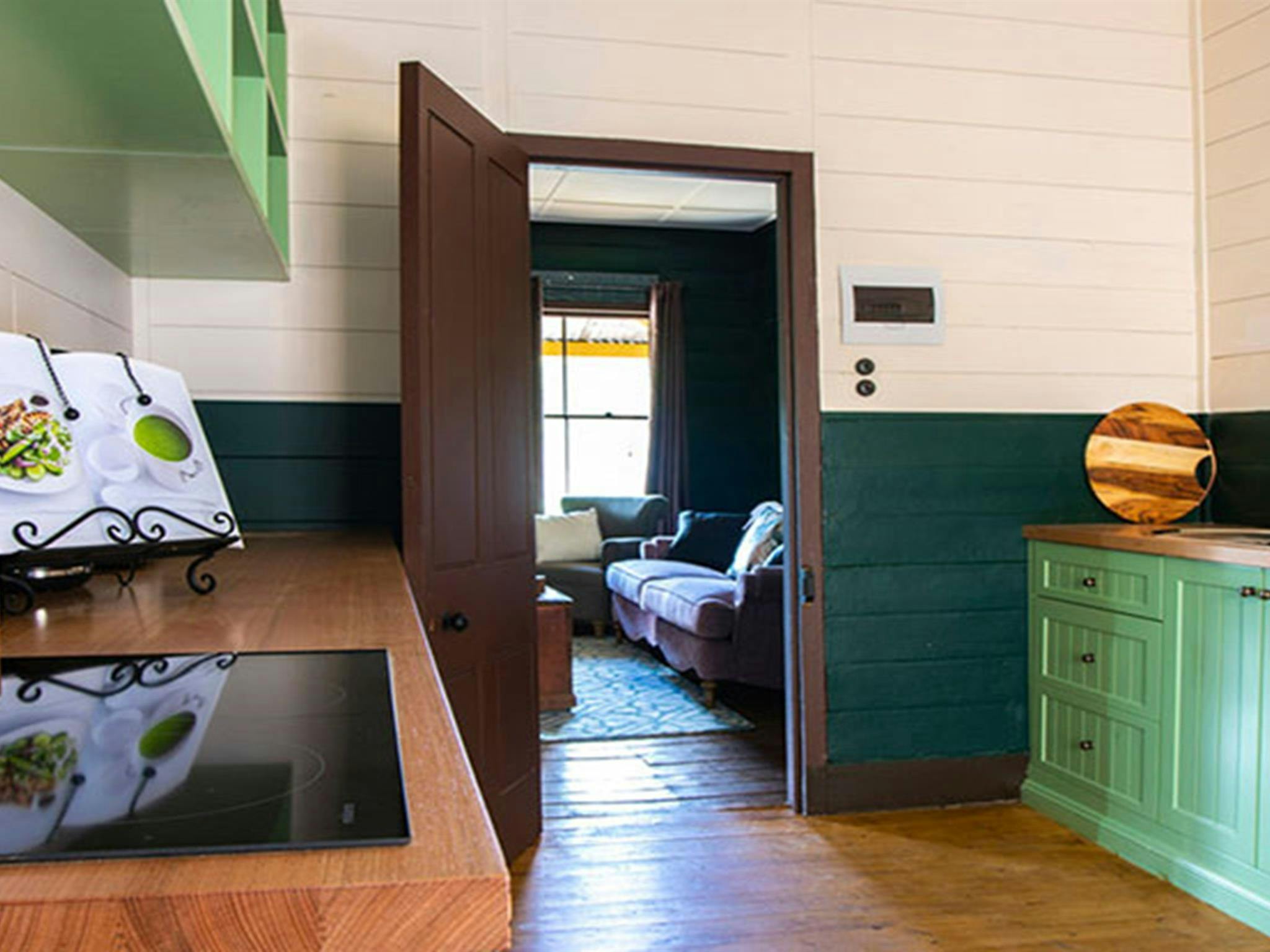 The kitchen with a view to the lounge room in Sydney Hotel Cottage, Hill End Historic Site. Photo: