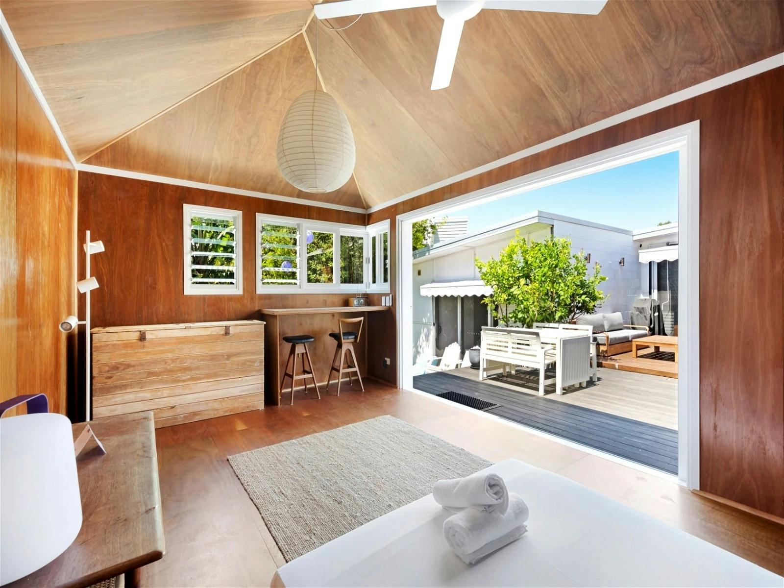 Room with a sofa bed and an ensuite bathroom