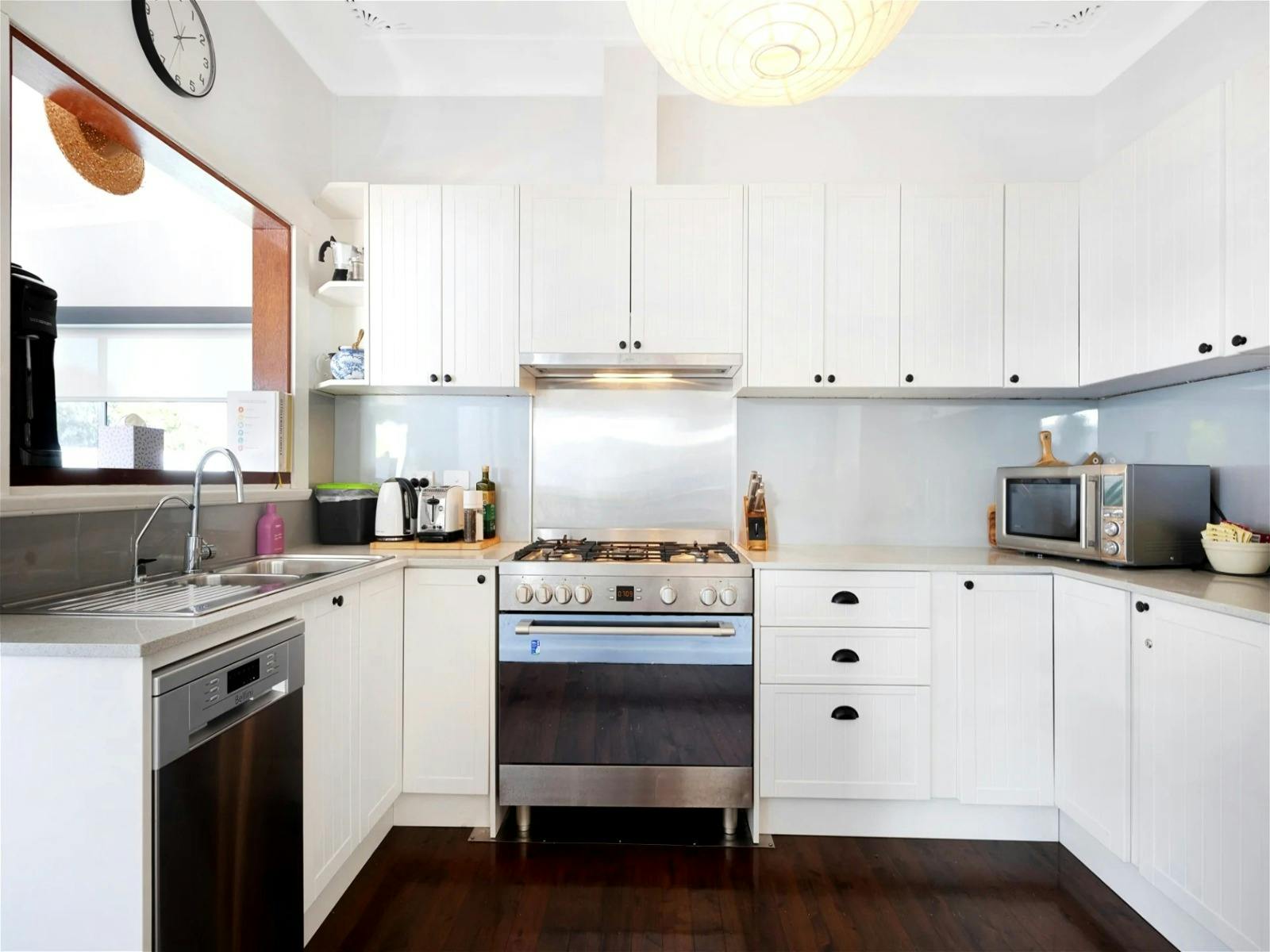 Separate kitchen area with modern appliances and ample storage