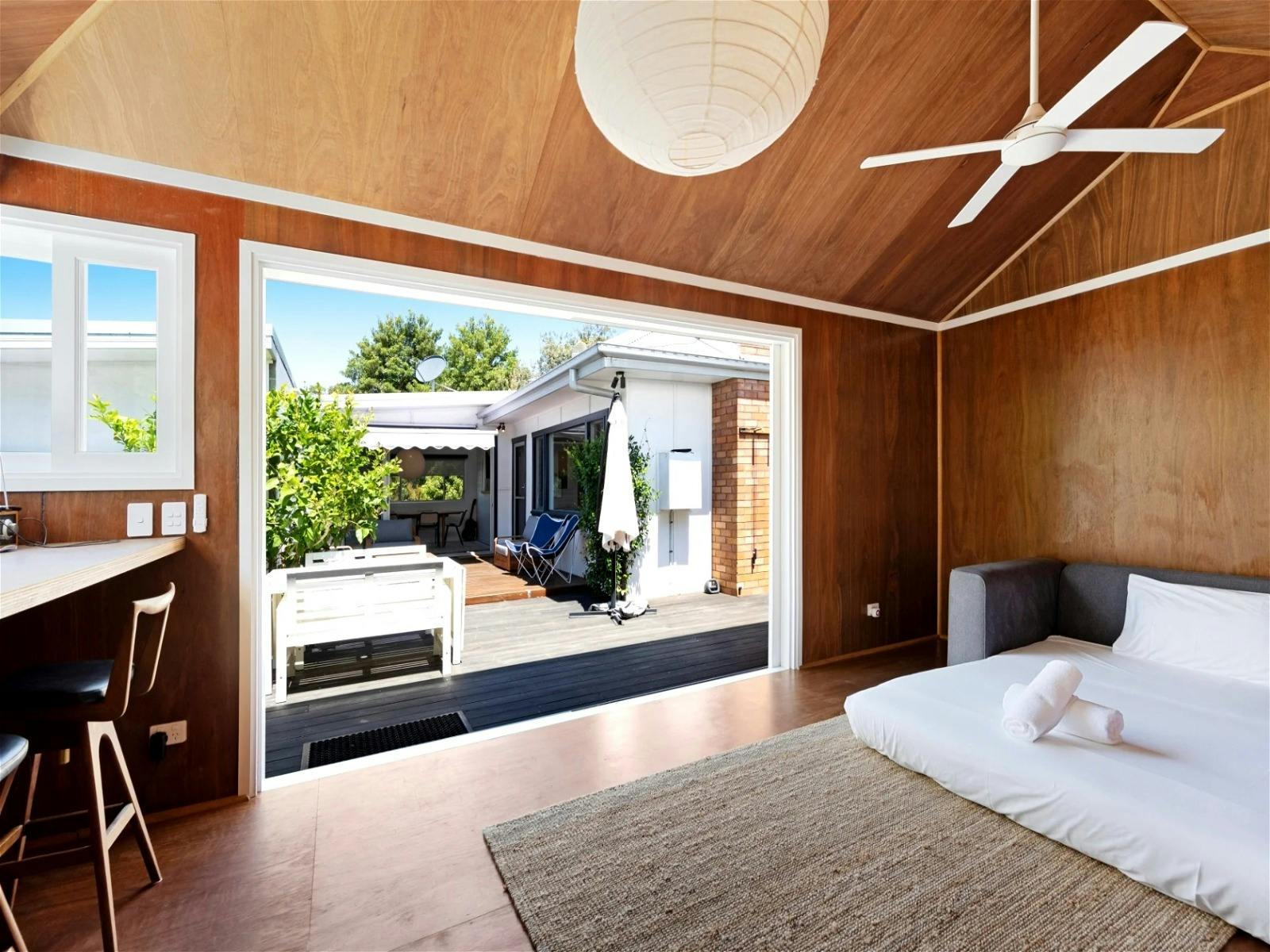 Room with a sofa bed and an ensuite bathroom