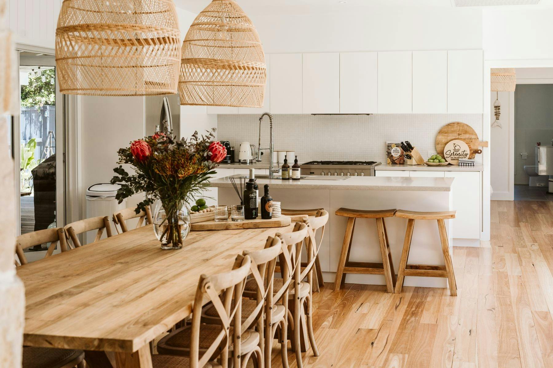 Serenity - Large dining area furnished with a heavy timber table and chairs perfect for entertaining