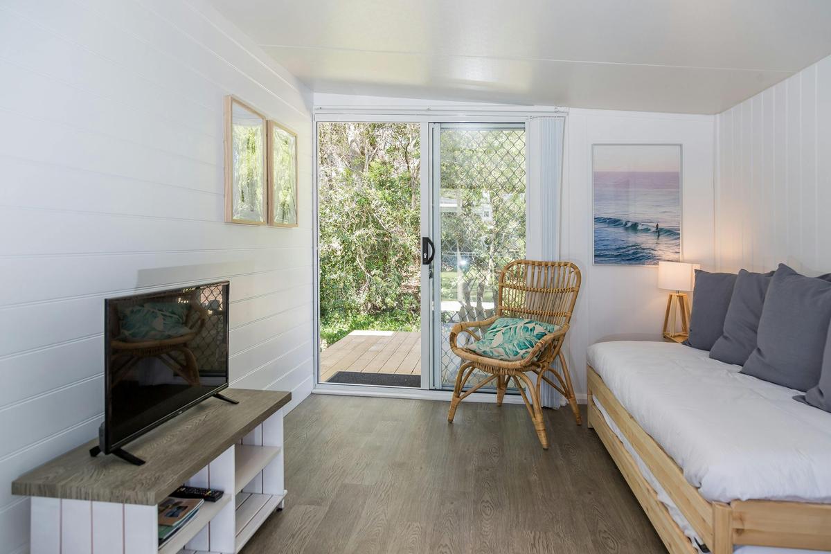 Surfside Caravan 3 living  with day bed that converts to two single beds and private deck