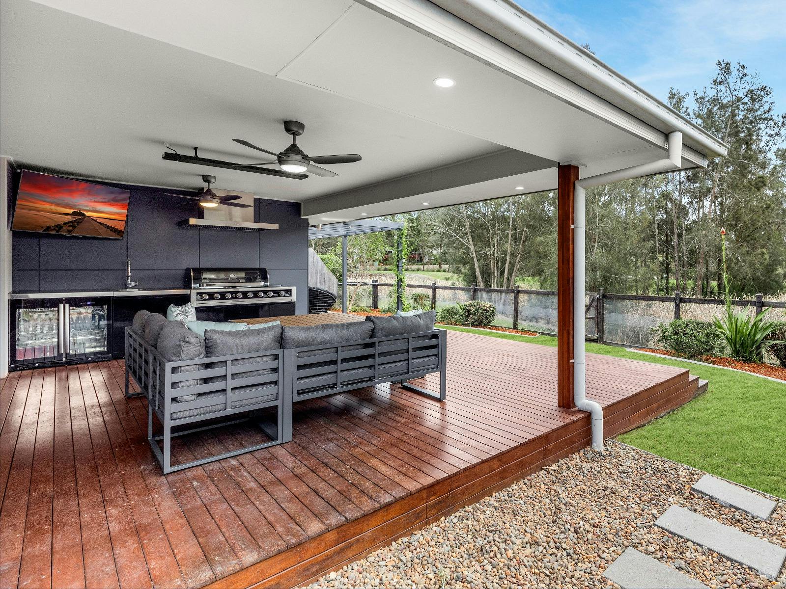 Tee To Greens outdoor entertainment area with bar fridge and BBQ