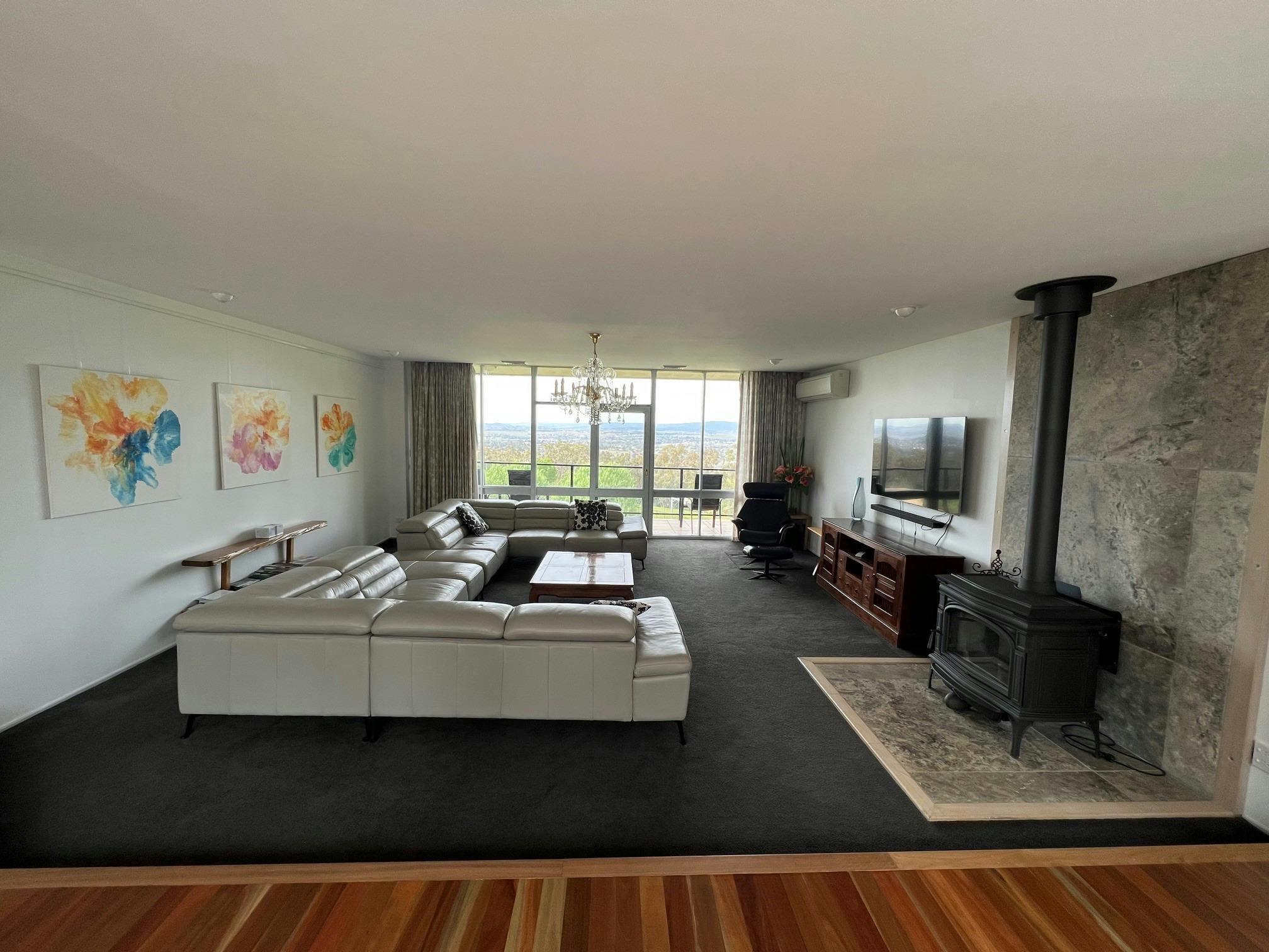 Upstairs lounge room with wood fireplace
