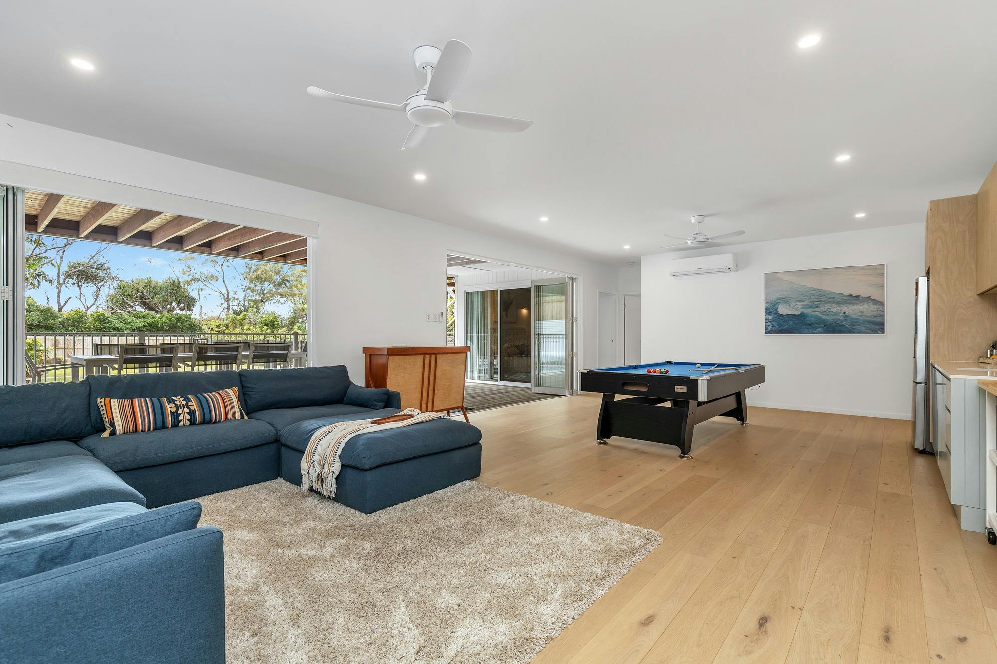 the massive lounging couch with pool table