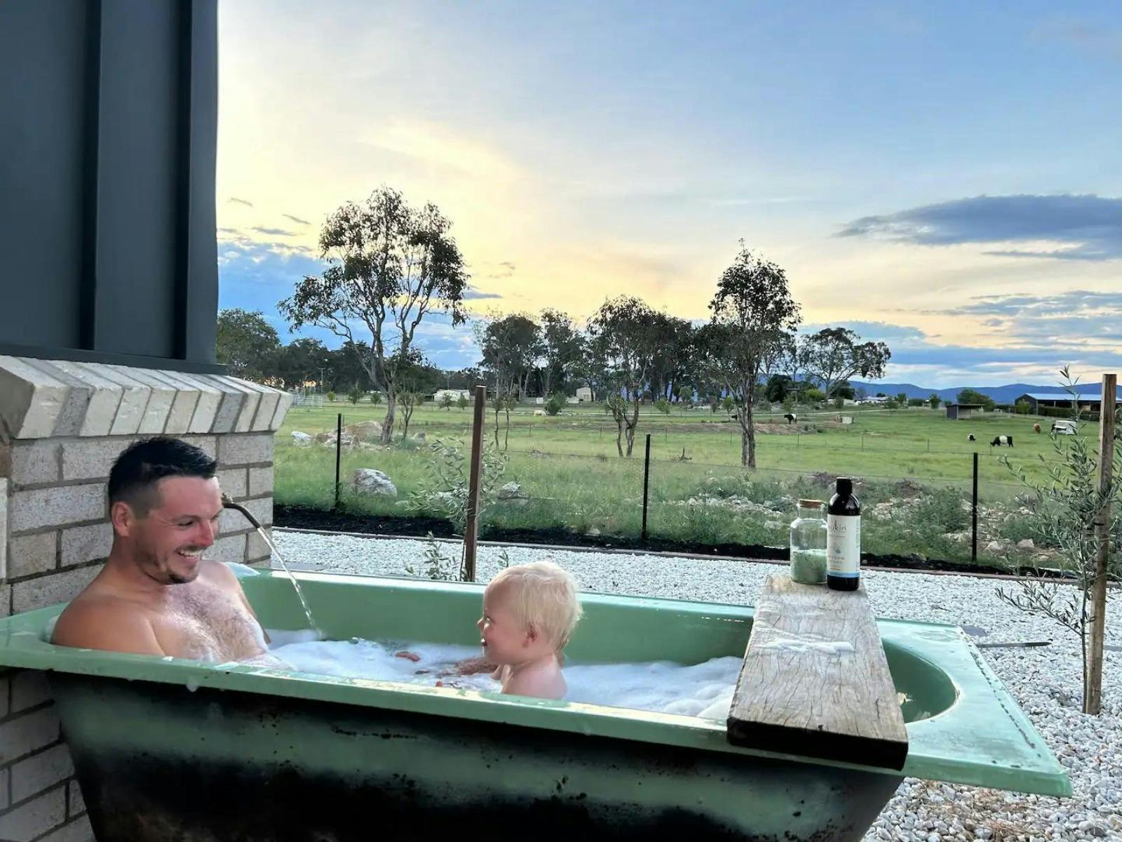 Father and child in bathtub