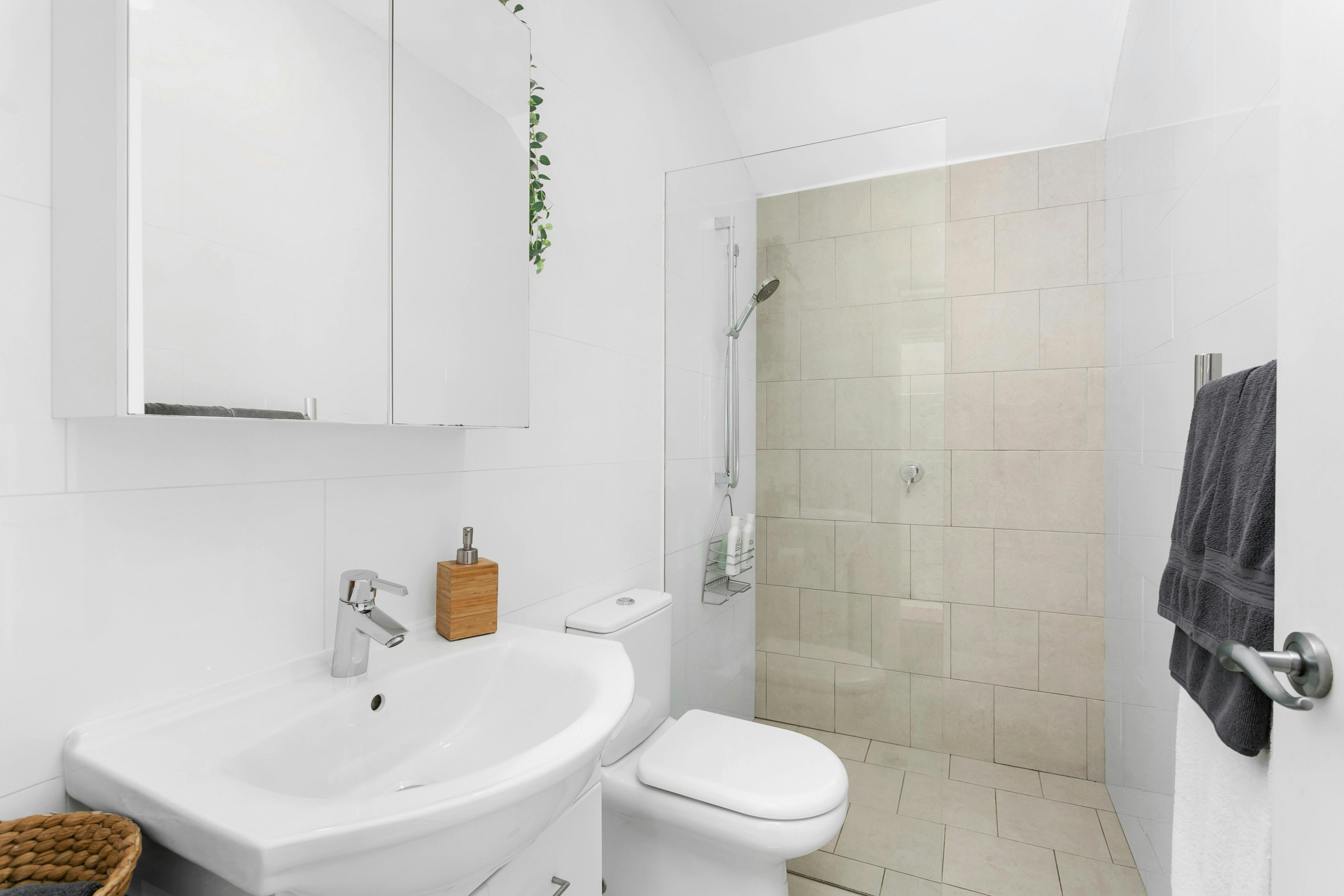 Bathrrom with walk in shower, heated towel rail, heat lamp and space to unpack